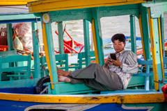 Man on a boat in Hoi An